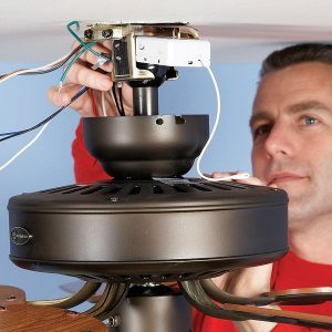 Electrician Installs A Ceiling Fan