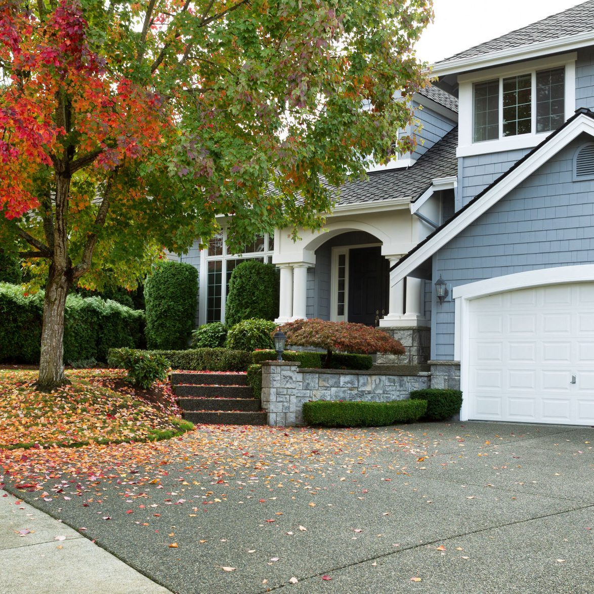 Blue House With Leaves Changing Color